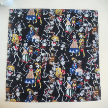 Load image into Gallery viewer, Fabric with colorful skeleton designs on a black background