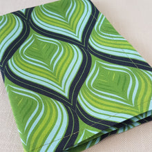 Load image into Gallery viewer, Green, aqua, and black swirl design on a linen–cotton cocktail napkin with crisp, tailored edges