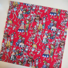 Load image into Gallery viewer, Red fabric with colourful skeleton and day of the dead design on a white background