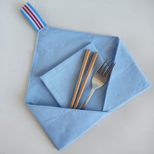 Load image into Gallery viewer, Light Blue cotton folded cocktail napkin in a fabric cutlery holder wrap with cutlery and chopsticks in the wrap.