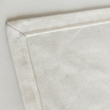 Load image into Gallery viewer, Close-up of a mitered hem of cream linen cotton napkin