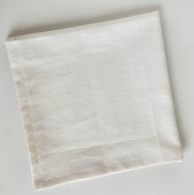 Load image into Gallery viewer, Linen cream coloured napkin folded over in a quarter