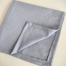 Load image into Gallery viewer, Folded napkin coloured purple blue, with mitered corners shown