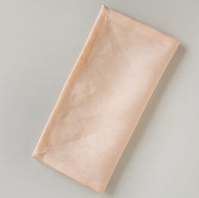 Load image into Gallery viewer, folded peach coloured napkin

