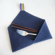 Load image into Gallery viewer, Dark midnight blue linen cutlery wrap  utensil holder with fork and chopsticks , with a rainbow elastic loop, on a white background