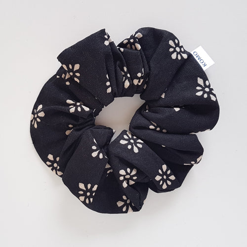 Gorgeous print with sand coloured spotted flowers in batik print design on a soft black cotton linen blend fabric. The perfect messy bun scrunchie. This hair scrunchie is super soft and comfortable to wear. One of our beautiful scrunchies - made in a small batch limited edition print.